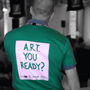 ART-Forum explores a future with autonomous cars: How to take a smart road path to embracing the benefits while minimising the risks? Photo: Taxistop Man wearing a green t-shirt saying "A.R.T. you ready?"