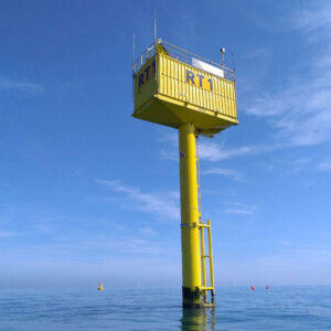 "Blue Accelerator" is a test facility designed for testing offshore wind technologies above, on, and under water. Inn2POWER's platform Testfacilities.eu helps innovators find the right test facility for their technology in a few clicks. A bright yellow offshore wind technology testing device in a blue sea.