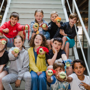 2IMPREZS places pupils at the heart of their schools’ energy savings initiatives through the joint 2IMPREZS Energy Challenges, which will reduce CO2 by 7320 tonnes. In this photo, the Belgian ‘Energizers’ show off their Energy Eaters. The Energy Eaters, invented by the Belgian pupils for the transnational Energy Challenges, are little creatures that mark energy-consuming devices to show where energy savings are possible. They represent a main goal of 2IMPREZS: making energy saving fun! Photo: CompagnieFotography/Province of Antwerp School kids who act as "energizers" helping their school shave 30% off their energy use gathered on a staircase.