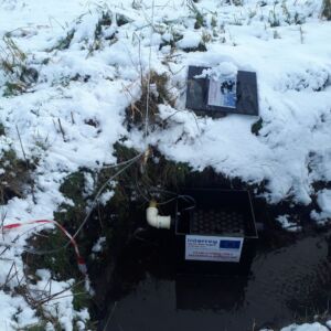 NuReDrain partner University of Gent tests light and compact filter boxes for phosphorous filtration in drainage fields. Here we see a filter box at a experimental test site of Inagro in Zedelgem. Filterbox for removal of phosphorous from drainage water on a snowy day