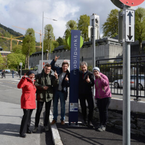 The first shared mobility hub - mobil.punkt - in Bergen (Norway), one year after its inauguration. People waiting at a shared mobility hub.