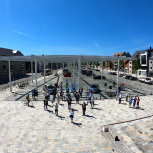 SHARE-North: Opening of a mobihub in May in Flanders, Belgium. It was made corona proof by placing the people at a distance while forming the mobihub logo. People standing at a distance, forming a logo signifying shared mobility.